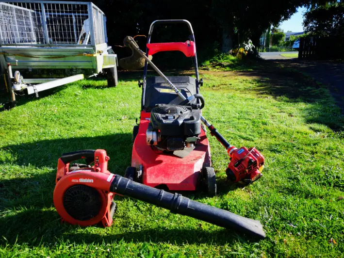 Lawn care equipment on grass